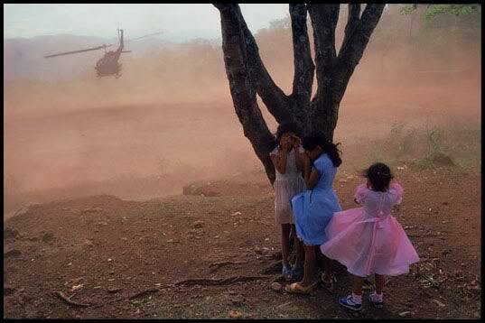 El Salvador, 1984 - Army evacuated wounded soldiers from village football field.