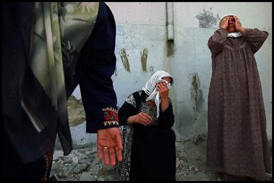 West Bank, 2002 - Mourning the dead in Jenin refugee camp.